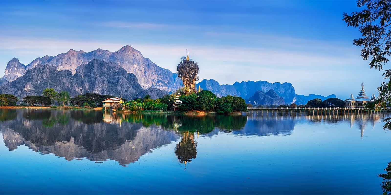 Kyauk Kalap Pagoda and reflection over lake