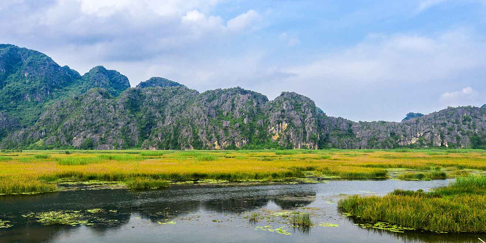 Mountain and lake scenery at Van Long Nature Reserve in Vietnam