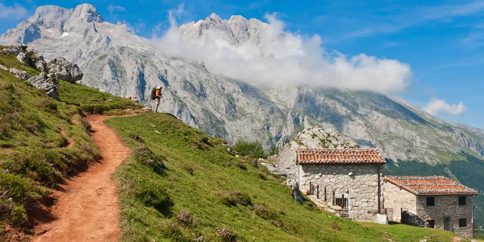 Hiker enjoying a route to Picu Urriellu, in the Picos de Europa.