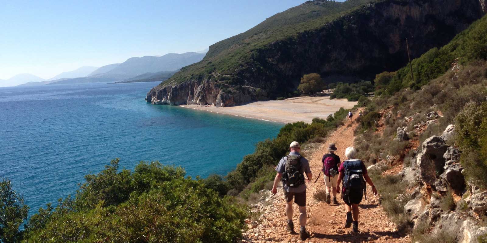 Group walking along the coast in Albania