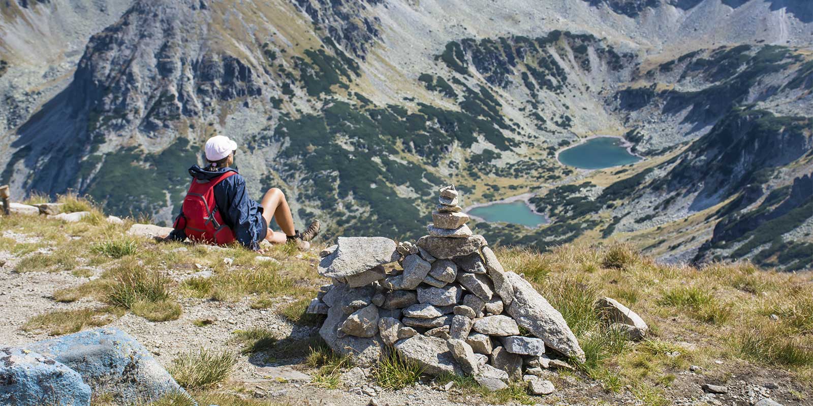 Hiker resting at Musala Peak in Rila Mountains Bulgaria