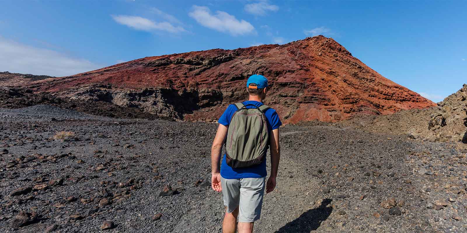 Hiker in Timanfaya National Park in Lanzarote in the Canary Islands