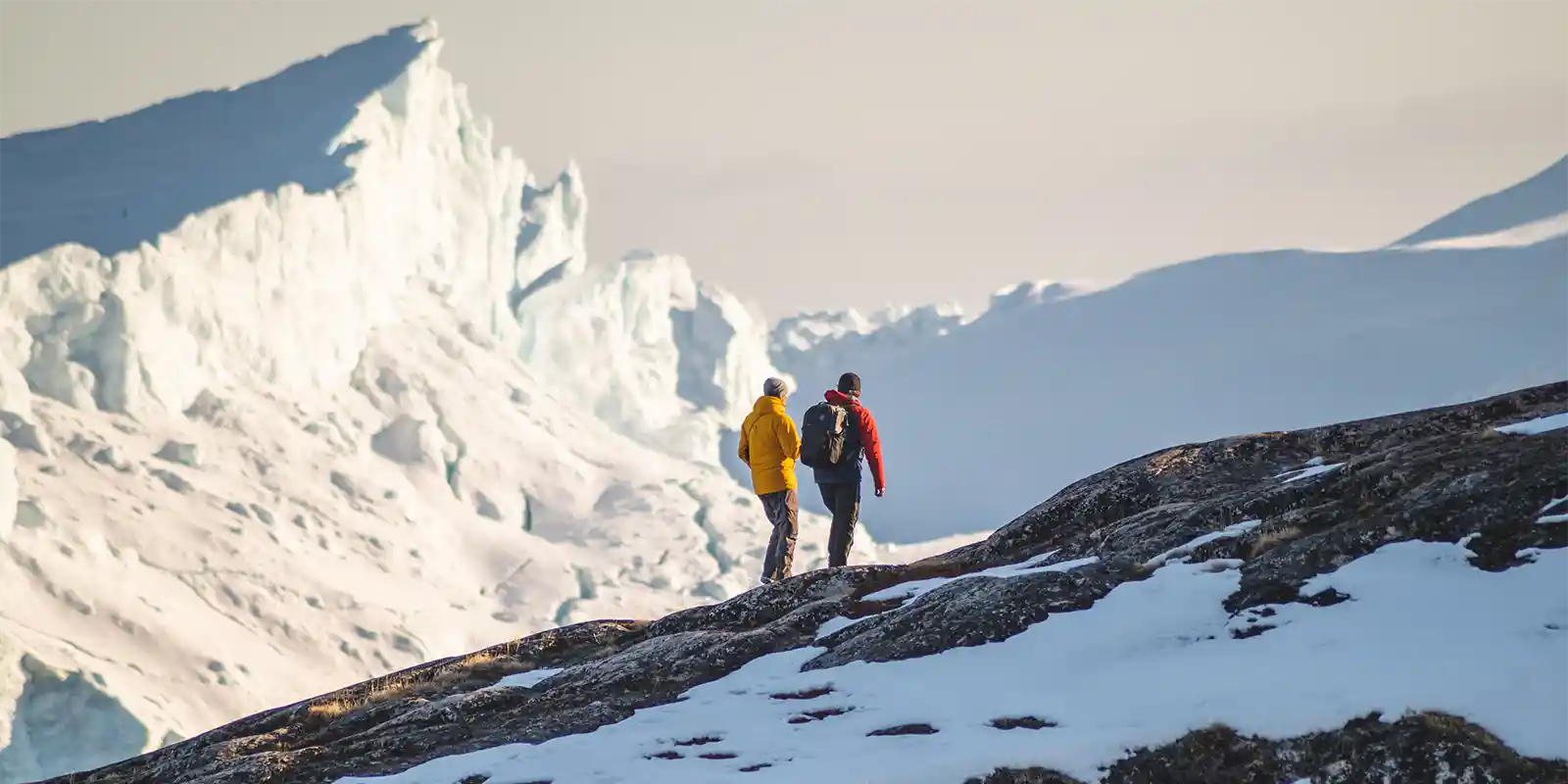 Hikers at the Ilulissat Icefjord in Greenland, Arctic