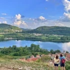 Walkers enjoying a lake view in Italy