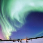 Snowshoeing under the Northern Lights in Finland