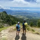 Hikers enjoying the view in the French Alps, France.