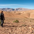 Hiker walking through the High Atlas Mountains in Morocco