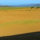 Shadow of a walker on a ridge in the Gobi Desert, Mongolia.
