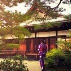 Traditional kimono dress outside Kinakuji Temple in Kyoto, Japan