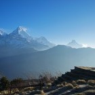 Woman standing on Poon Hill in Ghorepani, Nepal