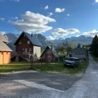 Traditional buildings & Durmitor Mountains in Montenegro.