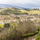 A train crossing over a bridge in the Douro Valley, Portugal