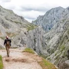 Tourist hiking in Cares Gorge, in Picos de Europa, Spain.