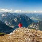 Hiker at a viewpoint on the Dachstein Alpine Trek in Austria