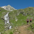 Two hikers ascending mountain at Hohe Tauern in the Austrian Alps
