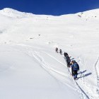Group snowshoeing up a mountain in Austria