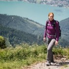 Hiker on trail up Schafberg mountain overlooking Wolfgangsee