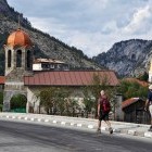 Hikers walking through Trigrad village in Bulgaria