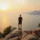 Lone trekker on Golf of Porto at Sunset on the island of Corsica