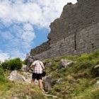 Hikers following the Cathar trail at Montsegur Castle in France