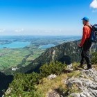 Hiker looking to Forggen Lake in Germany