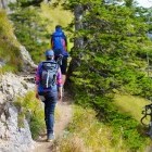 Hikers on a trail in Ammergau Alps in Germany