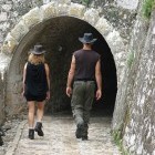 Two hikers in a town or village on the Greek island of Corfu