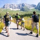Hikers on a trail in the mountains in Italy