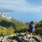 Hiker looking out to sea on the Amalfi Coast, Italy