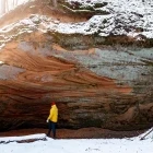 Man in a cave in Gaujas National Park, Latvia