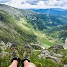 Hiking boots with hiker out of shot in the Carpathian mountains of Romania