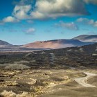 Hiker walking through typical scenery in Lanzarote in the Canary Islands