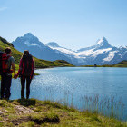 Hikers at Lake Bachalpsee in Grindewald, Switzerland
