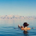 Woman floating in the Dead Sea, Jordan