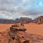 Hiker looking out to Wadi Rum Desert in Jordan