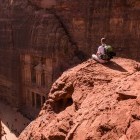 Hiker looking down on the Treasury in Jordan