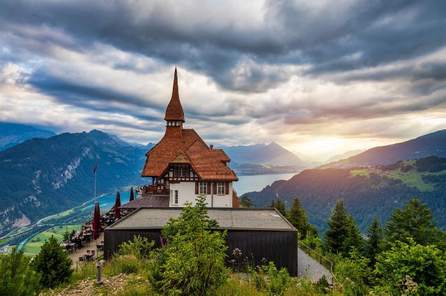Chapel atop a mountain with sunset