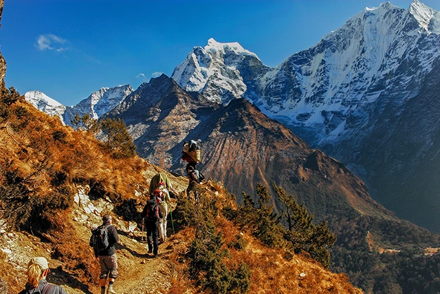 Hikers traversing a path in Khumbu Sagarmatha National Park, the Himalayas, Nepal