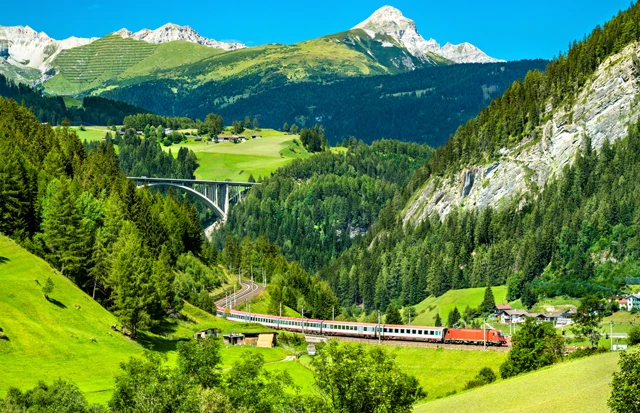 Train travelling through the Austrian Alps