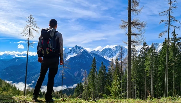 Hiker on the Alpe-Adria hiking trail in Italy