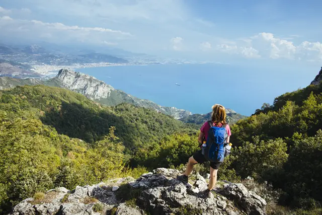 Hiker on the Path of the Gods hiking trail in the Amalfi Coast, Italy