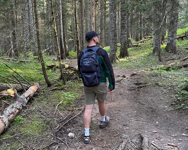 Tom walking through the forest down to the Black Lake in Durmitor National Park, Montenegro.
