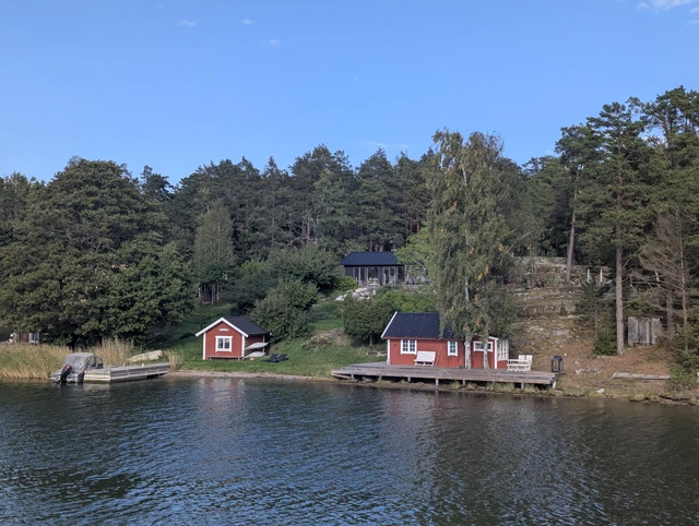 Traditional houses seen from the ferry in the Stockholm Archipelago in Sweden.