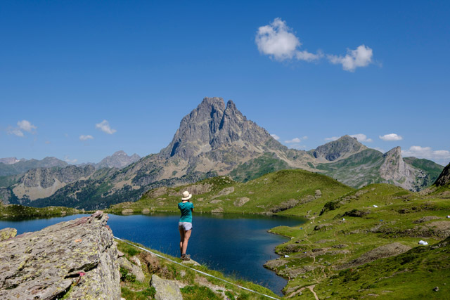 Hiker by Lake Gentau in the French Pyrenees
