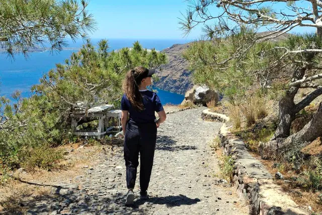 Walking along a trail in Santorini, Greece
