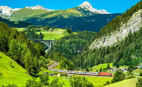 Train travelling through the Austrian Alps