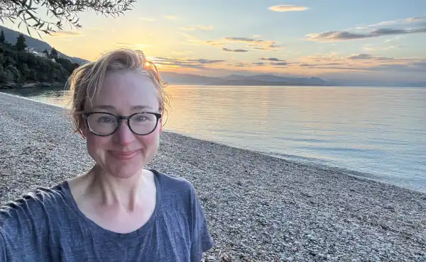 Image of Sarah on a beach in Corfu.