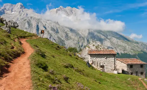 Hiker enjoying a route to Picu Urriellu, in the Picos de Europa.