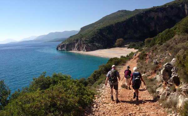 Group walking along the coast in Albania