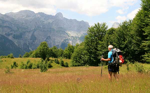 Trekker in the Thethi meadows Albania